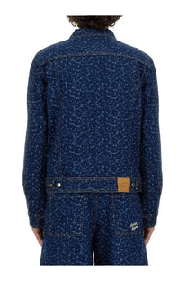 Maison Kitsuné men’s dark blue denim jacket with subtle white swirling pattern across the fabric