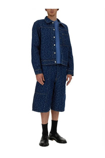 Maison Kitsuné men’s blue denim jacket with subtle white pattern paired with matching denim shorts