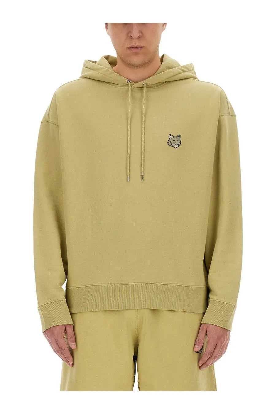 Maison Kitsuné men’s oversized beige hoodie in soft olive green with a subtle embroidered fox logo on the chest