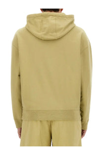 Maison Kitsuné men’s oversized hoodie in soft olive green with relaxed fit and ribbed cuffs for casual wear