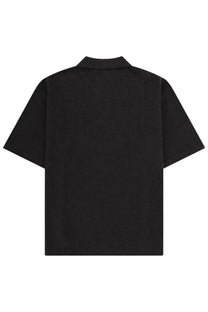 Maison Kitsuné men’s black short-sleeved polo shirt with classic collar and minimalist design front view