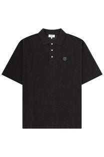 Maison Kitsuné men’s black short-sleeved polo shirt with textured weave, white buttons, and gray embroidered tiger logo