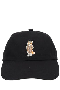 Maison kitsuné women’s black cotton baseball cap featuring an embroidered tan fox wearing shorts sneakers and a hat
