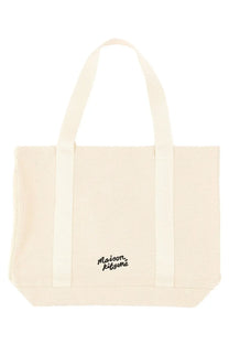 Cream-colored canvas tote bag with black embroidered maison kitsuné logo for women fox head print collection