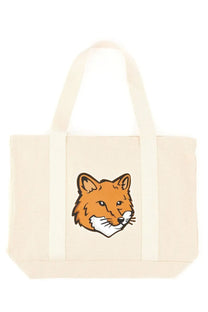 Cream-colored canvas tote bag with orange fox face print from Maison Kitsuné womens fox head print bag pink collection