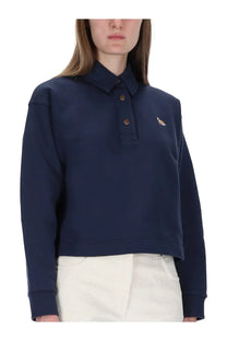 Navy blue cropped polo shirt with small embroidered logo on left chest from Maison Kitsuné women’s sweatshirt fox blue collection