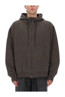 Maison margiela men’s hoodie brown in dark olive green with a relaxed fit zip-up design and front pockets