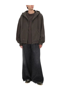 Maison Margiela men’s oversized olive green zip-up hoodie with drawstring hood and front pockets