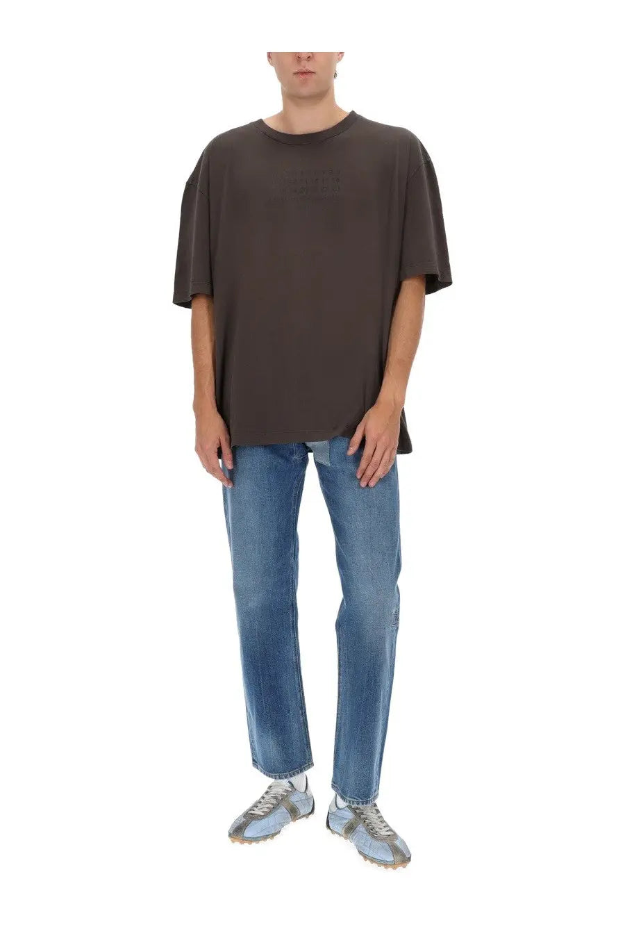 Maison margiela men’s jeans blue paired with a dark brown oversized cotton t-shirt with relaxed fit and short sleeves