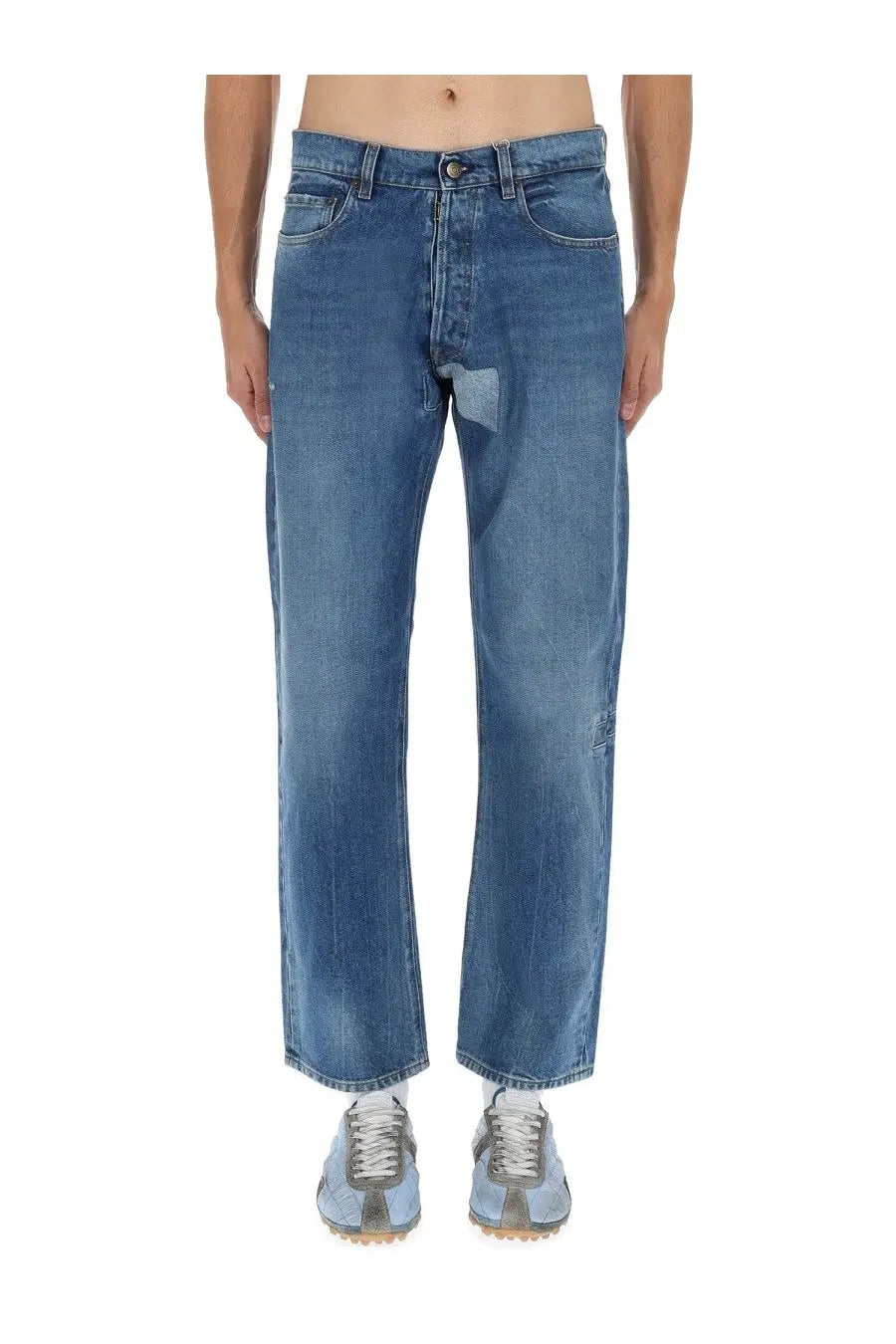 Maison margiela men’s jeans in medium-wash blue denim with straight-leg cut and subtle thigh distressing
