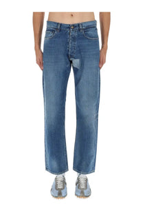 Maison margiela men’s jeans in medium-wash blue denim with straight-leg cut and subtle thigh distressing