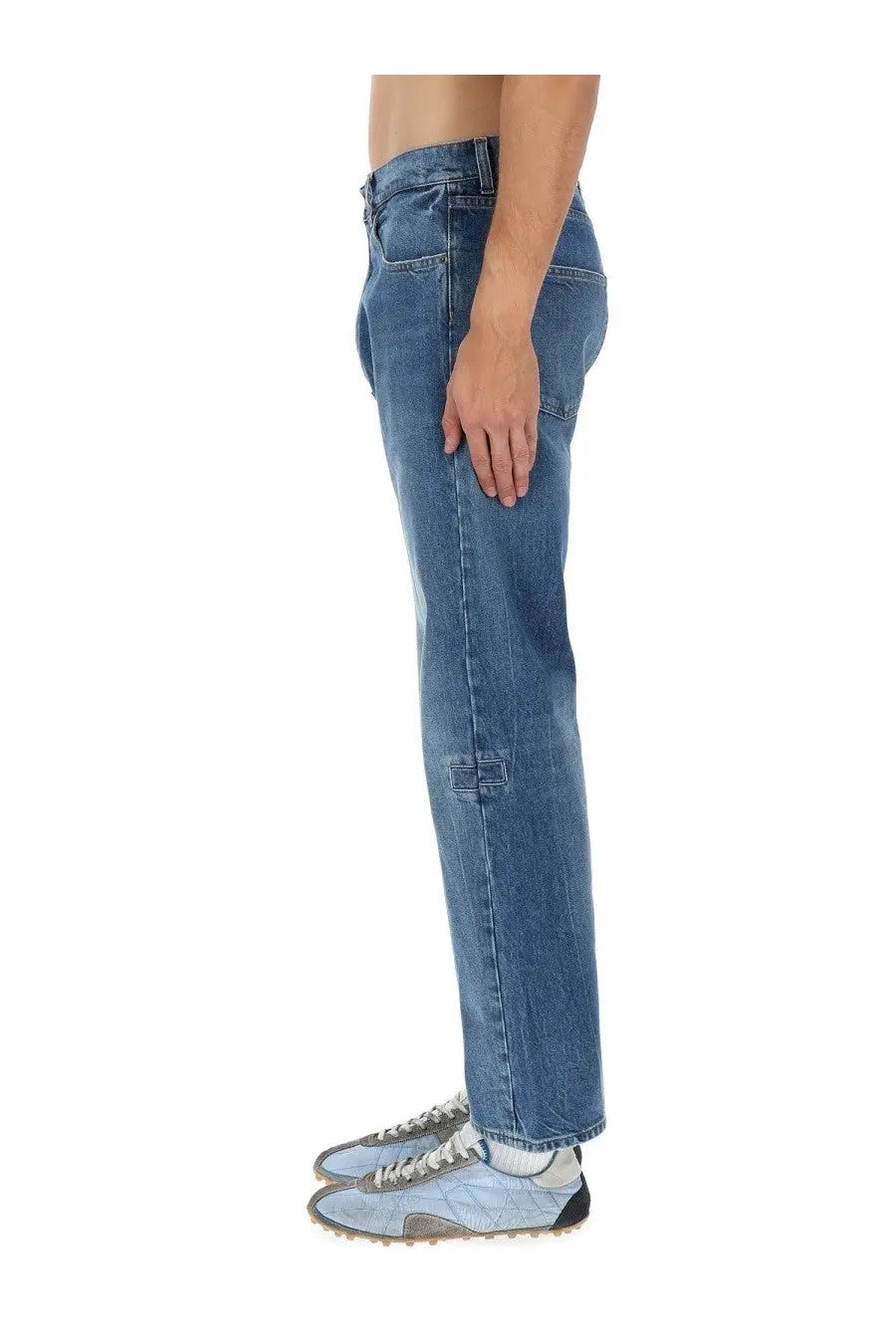 Maison Margiela men’s medium-wash blue denim jeans with a straight-leg cut and subtle distressing on the knee