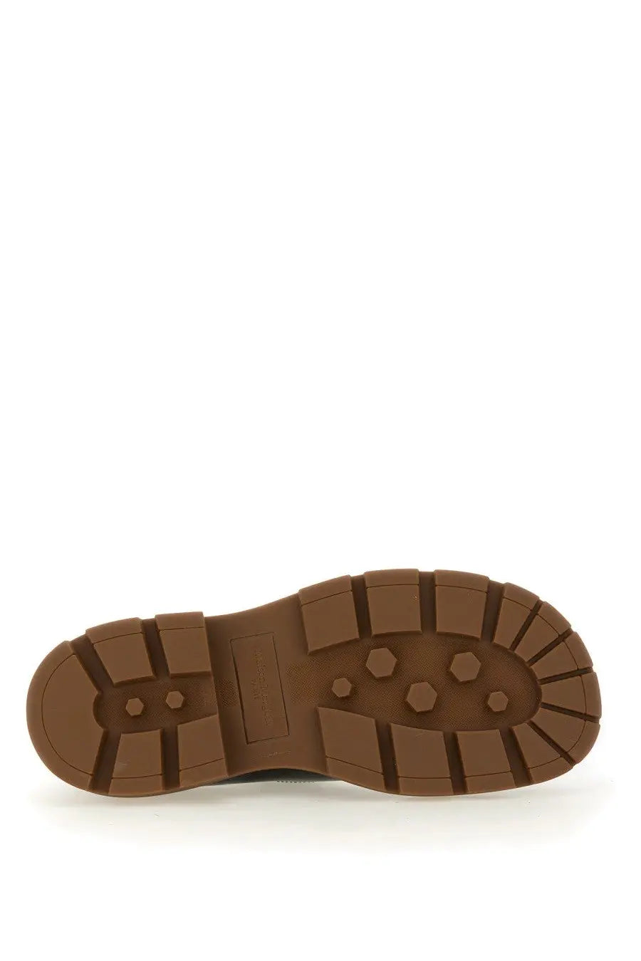 Brown rubber sole with hexagonal tread and reinforced heel block of maison margiela men’s black leather monk shoe back view