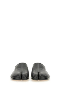 Maison Margiela men’s black leather tabi mules featuring a distinctive split-toe design for stylish wear