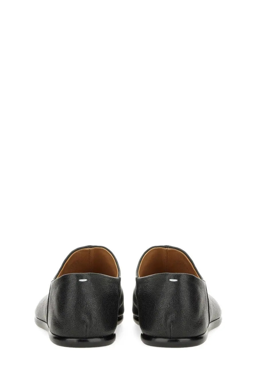 Maison Margiela men’s black leather tabi mules with subtle textured finish and tan lining shown from the back side