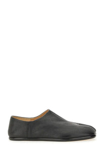 Maison Margiela men’s black leather tabi mules with a minimalist design and stitched toe seam slip-on loafer