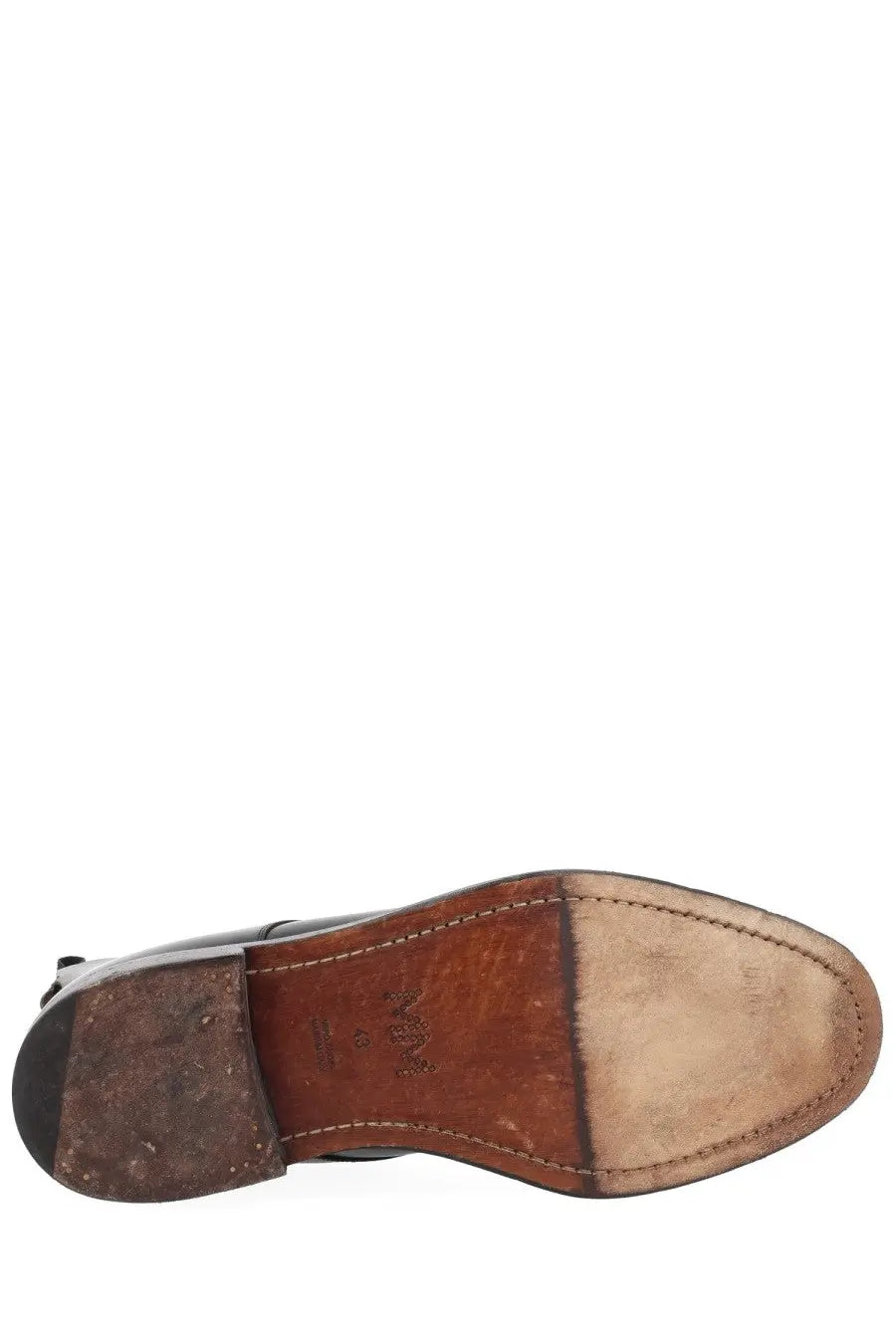 Maison Margiela men’s black leather boot with brown sole and visible stitching showcasing durable craftsmanship