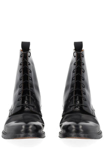 Maison Margiela men’s black leather lace-up boots with polished finish and rounded toe perfect for casual wear