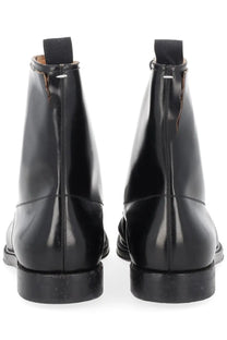 Maison Margiela men’s loved to death black patent leather ankle boots with glossy finish and contrasting stitching