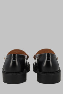 Maison Margiela men’s mocassino écortiqué black patent leather loafers with thick rubber sole and tan stitching details