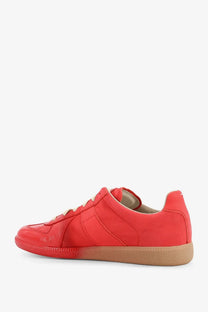 Maison Margiela men’s replica low-top sneaker in vibrant red suede with tan rubber sole and matching laces
