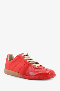 Maison Margiela men’s replica leather sneakers in vibrant red patent leather with cream laces and tan rubber sole