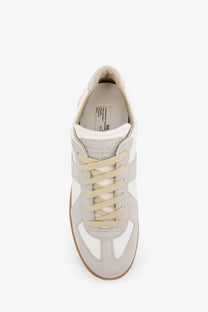 Maison Margiela men’s replica low top sneaker in white with gray suede upper beige laces and rubber sole