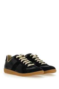 Maison Margiela men’s replica sneaker black in black matte with cream laces and tan rubber sole for casual wear