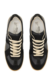 Maison Margiela men’s replica sneaker in black suede and leather with cream laces and classic low-top design