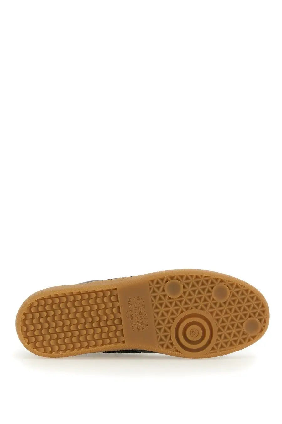 Tan rubber sole with textured pattern and circular logo detail on maison margiela men’s replica sneaker black