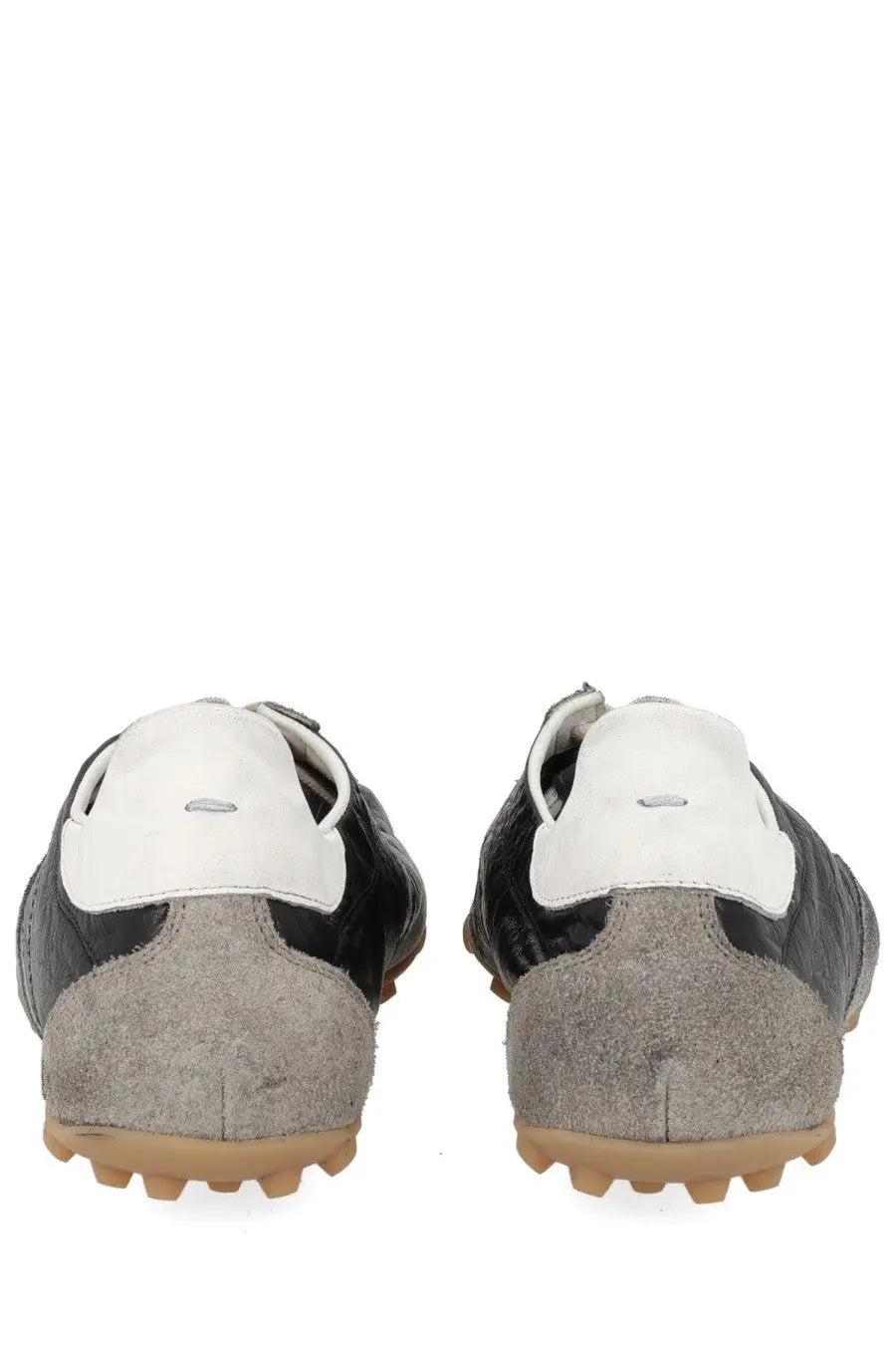 Maison margiela men’s sneaker sprinters in black with suede and leather, textured gray heel counter, and tan rubber sole