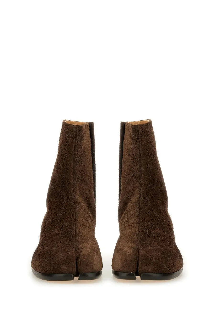 Maison Margiela men’s tabi boot in brown suede with split-toe design and black rubber soles shown from the back side