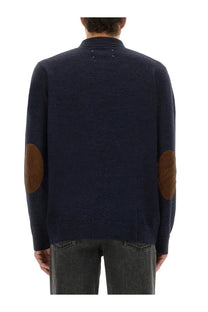 Navy blue Maison Margiela men’s wool polo sweater with brown leather elbow patches for casual wear