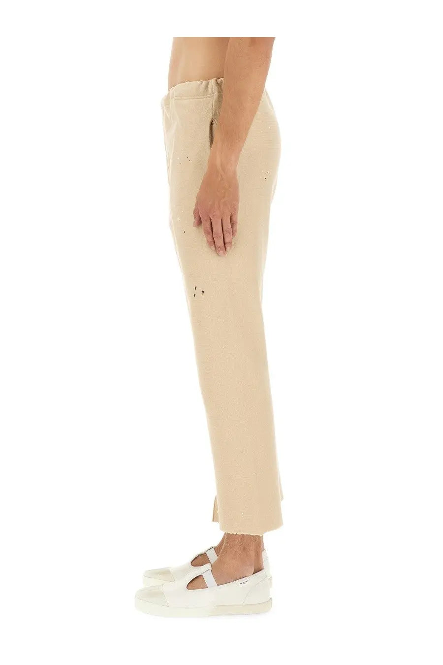 Maison Margiela unisex cotton beige cropped trousers with subtle perforated detailing and a relaxed tapered fit