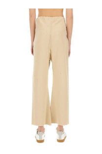 Maison Margiela unisex cotton pants white beige wide-leg trousers with relaxed fit and subtle distressing details