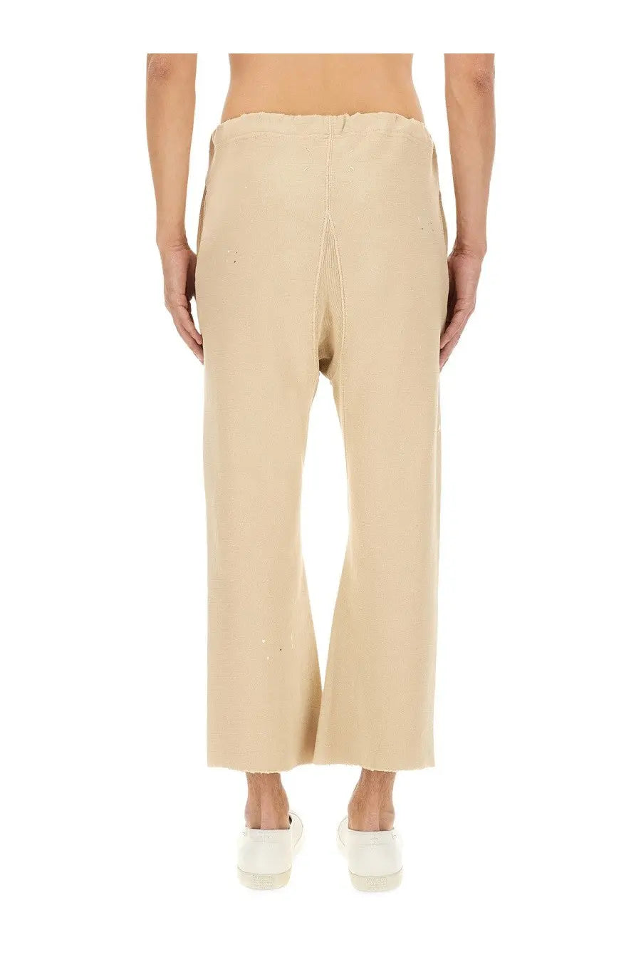 Maison Margiela unisex cotton pants in white featuring beige wide-leg trousers with relaxed fit and subtle front seam detailing