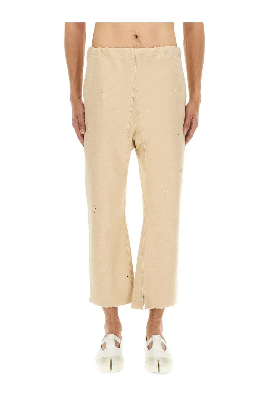 Beige Maison Margiela unisex cotton wide-leg trousers with subtle embroidery and raw hem detailing