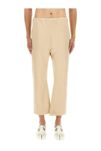 Beige Maison Margiela unisex cotton wide-leg trousers with subtle embroidery and raw hem detailing