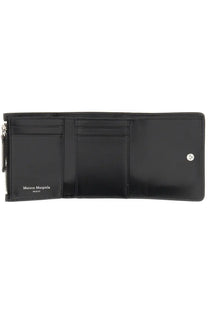 Maison Margiela unisex black leather tri-fold wallet with silver zipper button closure and paris branding inside