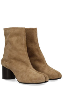 Maison Margiela women’s tan suede tabi boots with chunky black heel and contrasting black sole shown from the back