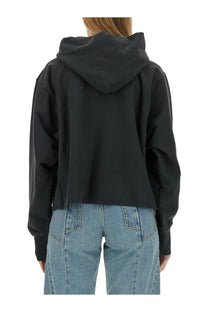 Maison Margiela women’s black cotton cropped hoodie with relaxed fit and ribbed cuffs perfect for casual wear