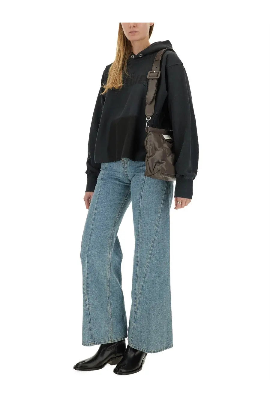 Dark brown nylon crossbody bag with adjustable strap and silver hardware shown with maison margiela black sweatshirt