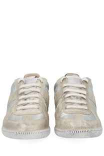 Maison Margiela women’s iridescent silver sneaker in metallic suede and canvas with white laces and textured sole
