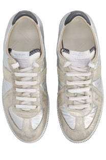 Maison Margiela women’s iridescent replica sneakers in silver metallic with distressed finish and white laces