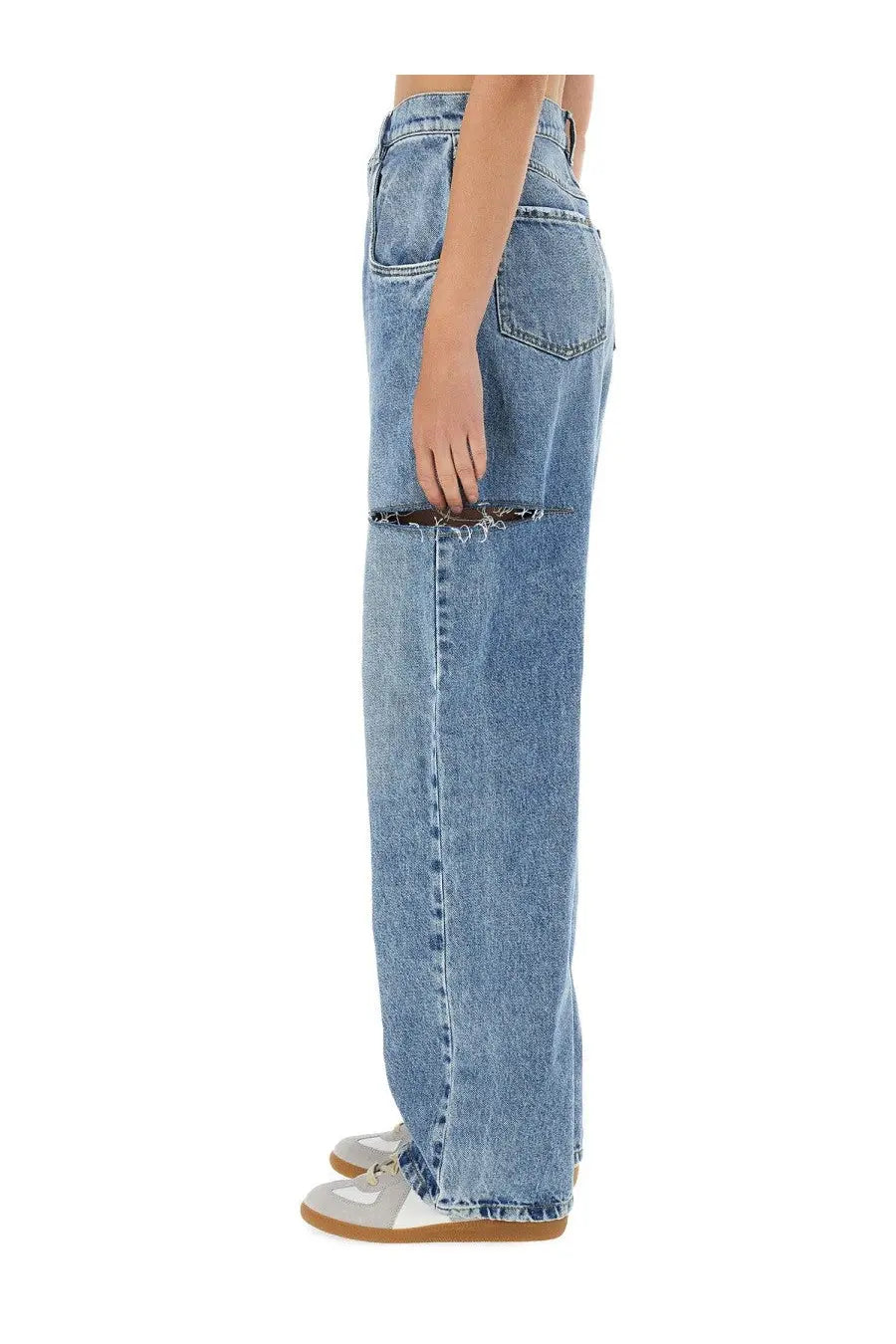 Maison Margiela women’s light-wash denim jeans with wide-leg cut and intentional distressing at the thigh in blue