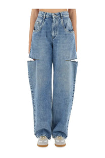Maison Margiela women’s light-wash denim jeans with wide legs and distressed ripped knees in blue