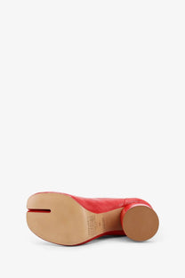 Maison Margiela women’s red leather tabi shoe with rounded heel and visible stitching details shown from the back side