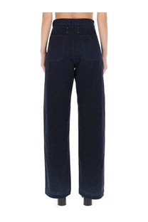 Dark navy Maison Margiela women’s wide-leg high waist trousers with visible stitching and herringbone fabric texture