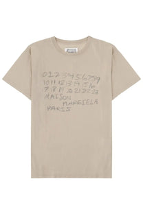 Beige maison margiela women’s t-shirt with gray handwritten style numbers and brand name printed on front