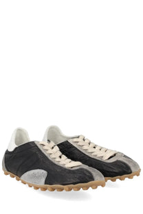 Maison Margiela women’s sneaker sprinters black with black and silver patchwork, cream laces, and textured rubber sole